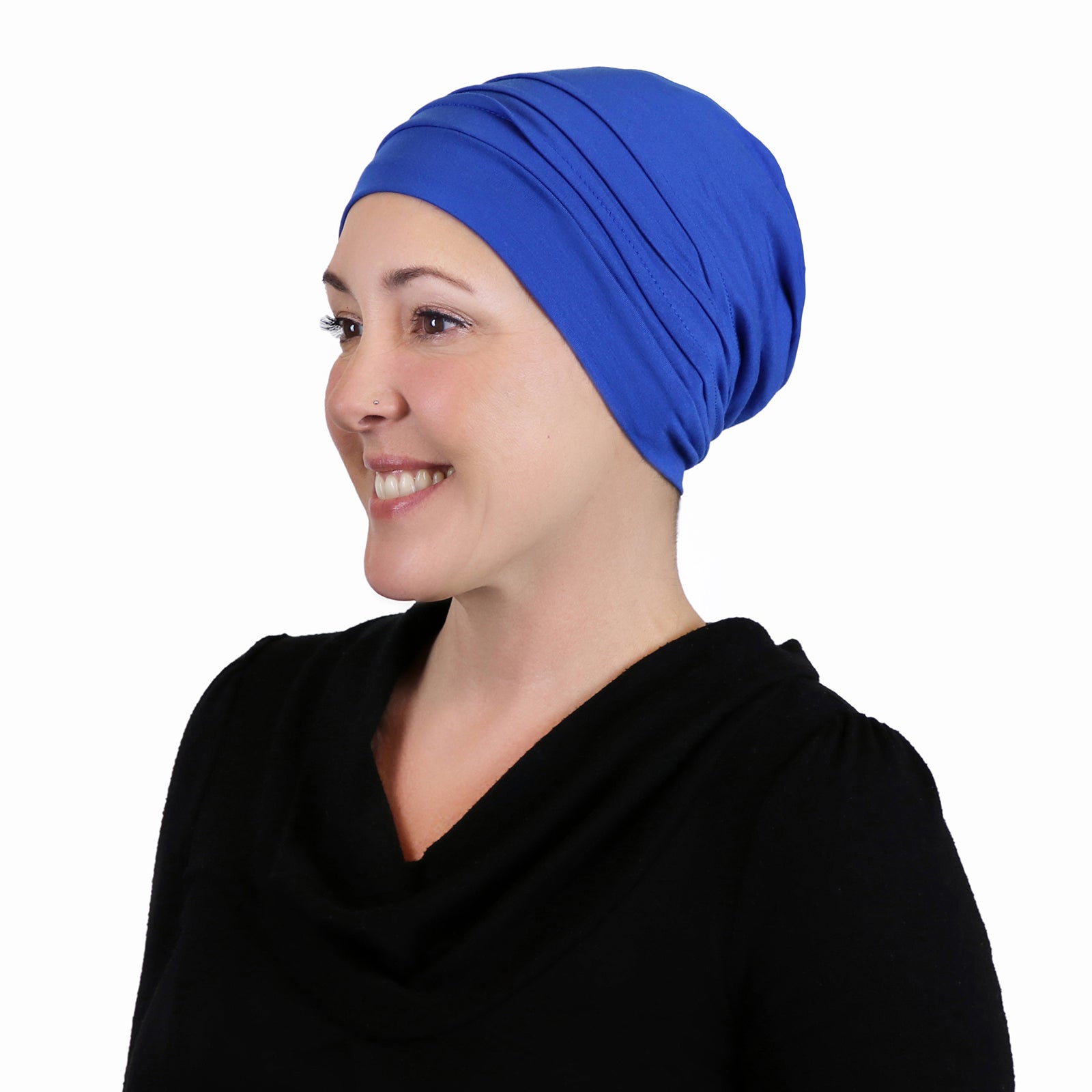Woman wearing azure blue slouchy beanie for chemo headwear side view showing nice slouch in the back