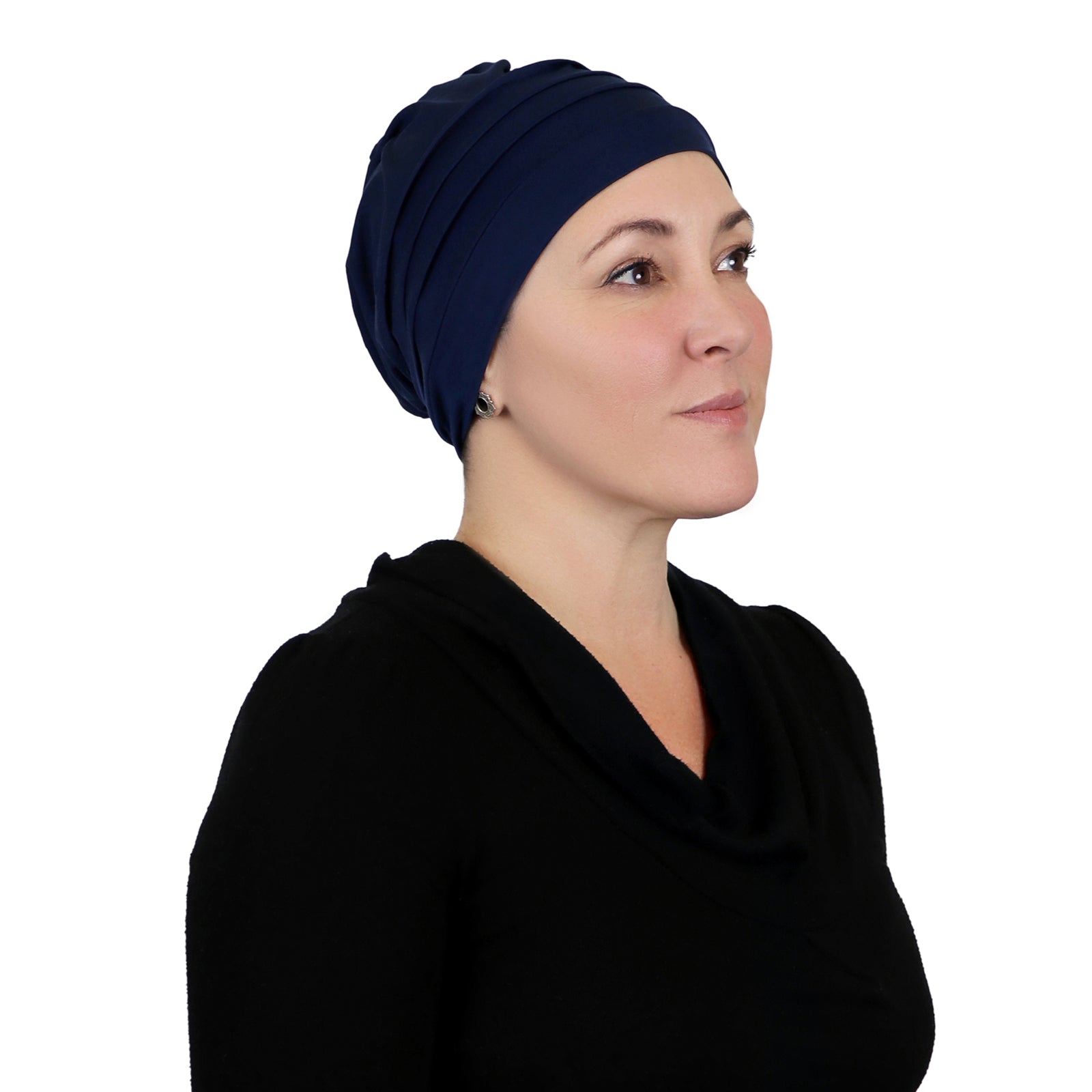 Woman wearing navy blue slouchy beanie for chemo headwear.