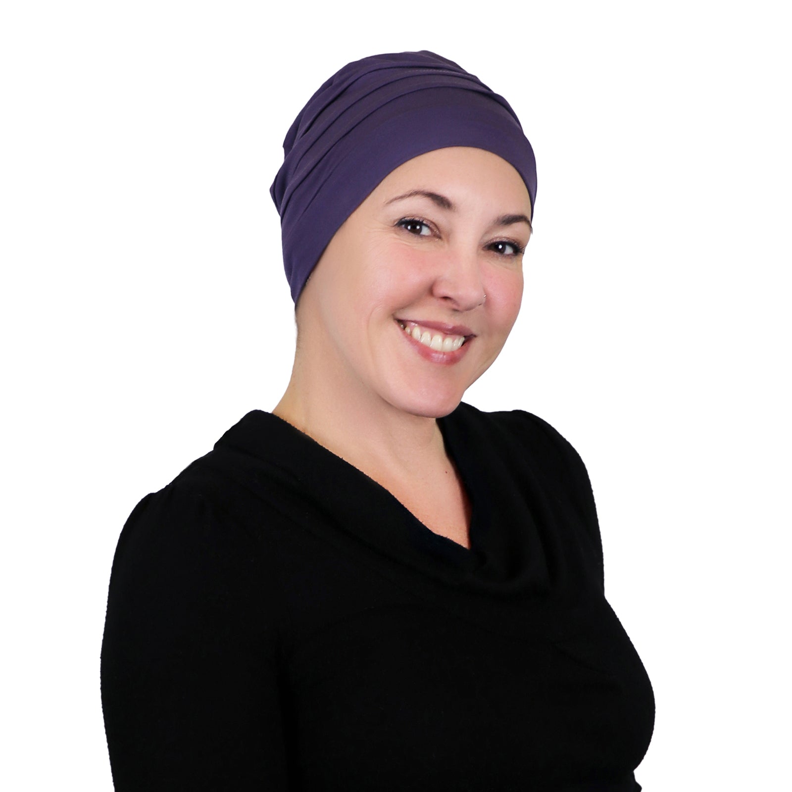Woman wearing dusty plum slouchy beanie for chemo headwear.