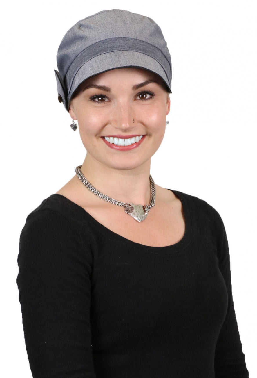 woman in grey newsboy cap with black trim