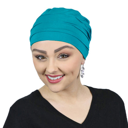 woman in teal bamboo turban for chemo patients 