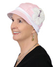 woman in pink cotton baseball style hat for chemo headwear