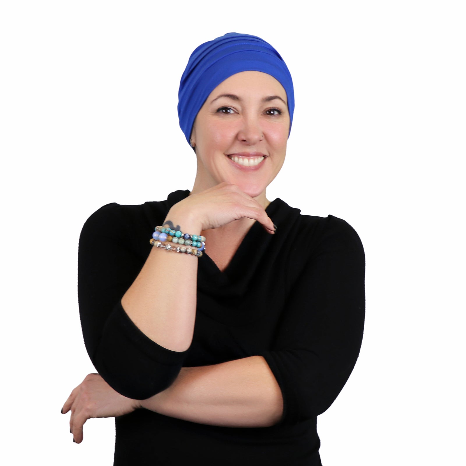 Woman wearing azure blue slouchy beanie for chemo headwear  