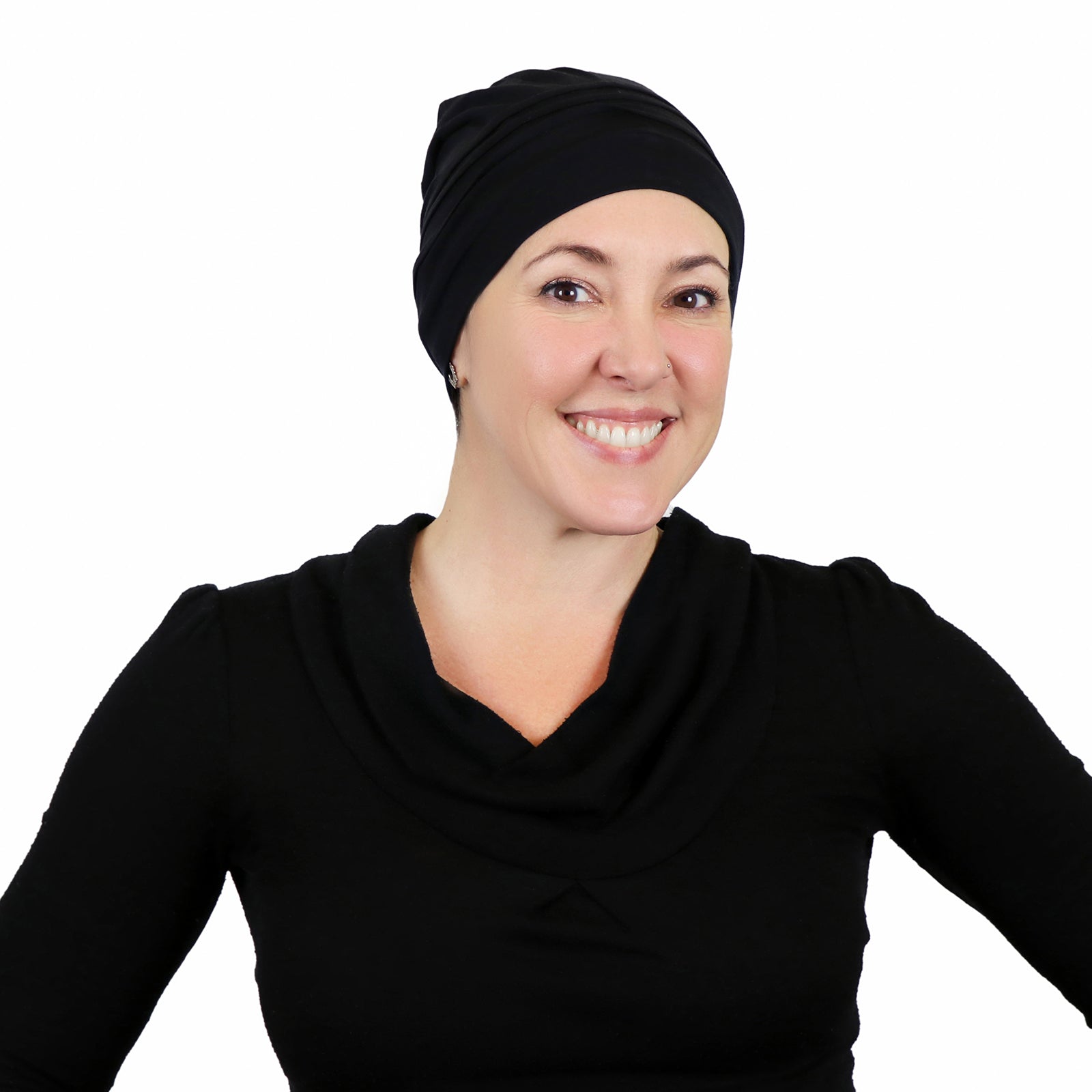 Woman wearing black slouchy beanie for chemo headwear  