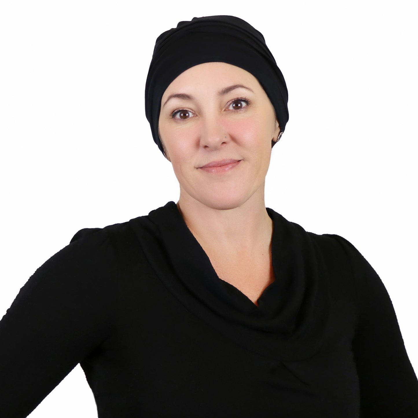 Woman wearing azure blue slouchy beanie for chemo headwear  