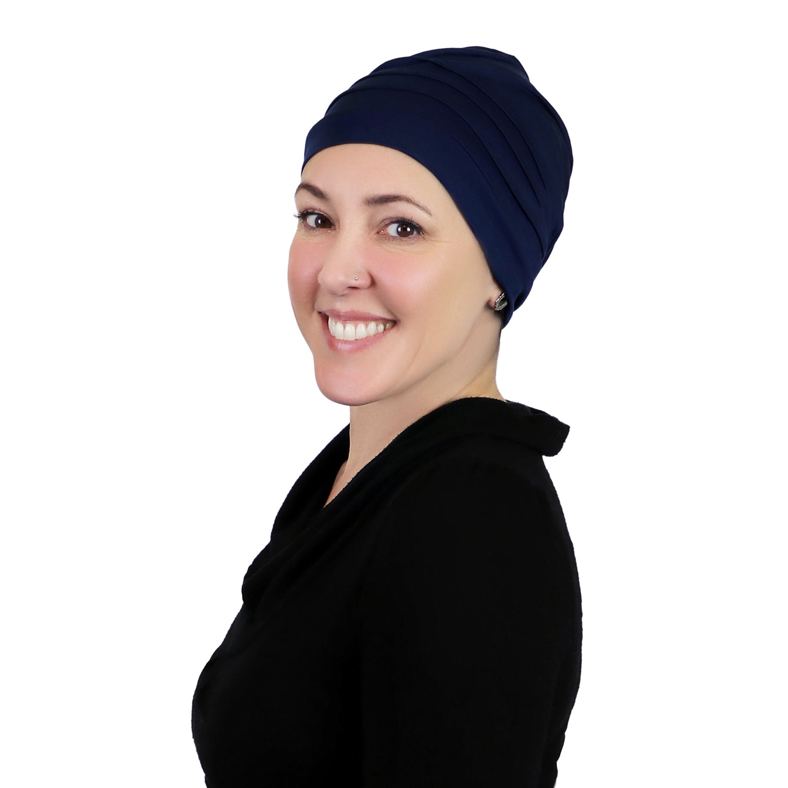 Woman wearing navy blue slouchy beanie for chemo headwear.  