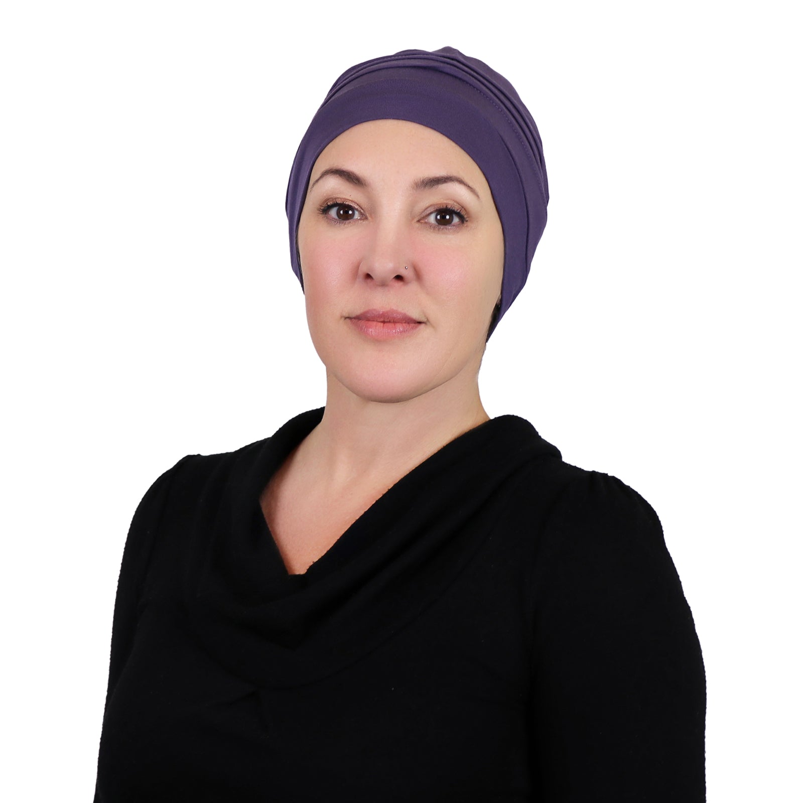 Woman wearing dusty plum slouchy beanie for chemo headwear. Front view 