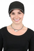 woman in black newsboy cap with white trim