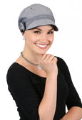 woman in charcoal grey newsboy cap with black trim and side button